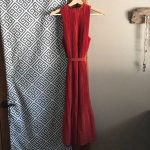Burnt orange pleated wedding guest dress